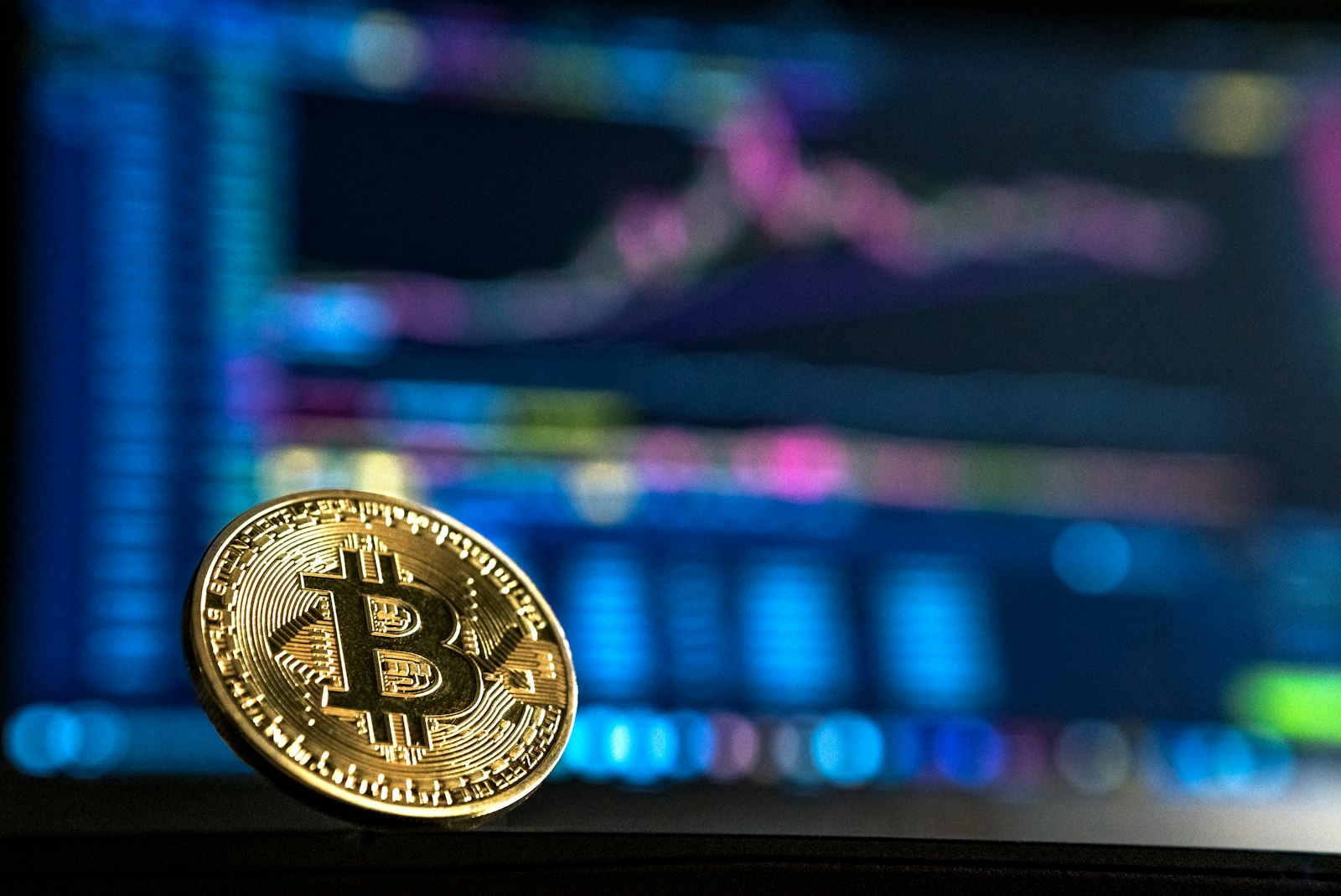 Cryptocurrency market screen and coin representing crypto policy votes